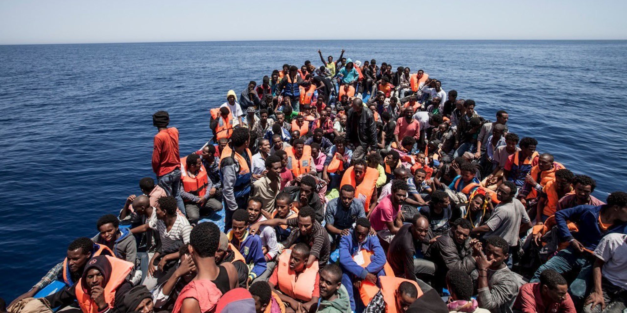Migrants crowd the deck of their wooden boat off the coast of Libya May 14, 2015.  International non-governmental organisations Medecins sans Frontieres (MSF) and MOAS (Migrant Offshore Aid Station) rescued 561 migrants at sea off the coast of Libya on Thursday, according to Maltese media. Their vessel, the Phoenix, is the first privately funded vessel to operate in the Mediterranean. Almost 3,600 migrants have been rescued from overcrowded boats sailing from Africa to Europe over the past 48 hours, Italy said on Thursday, with sea conditions seen as perfect for attempting the crossing. REUTERS/MOAS/Jason Florio/Handout via Reuters

ATTENTION EDITORS - NO SALES. NO ARCHIVES. FOR EDITORIAL USE ONLY. NOT FOR SALE FOR MARKETING OR ADVERTISING CAMPAIGNS. THIS IMAGE HAS BEEN SUPPLIED BY A THIRD PARTY. IT IS DISTRIBUTED, EXACTLY AS RECEIVED BY REUTERS, AS A SERVICE TO CLIENTS

      TPX IMAGES OF THE DAY